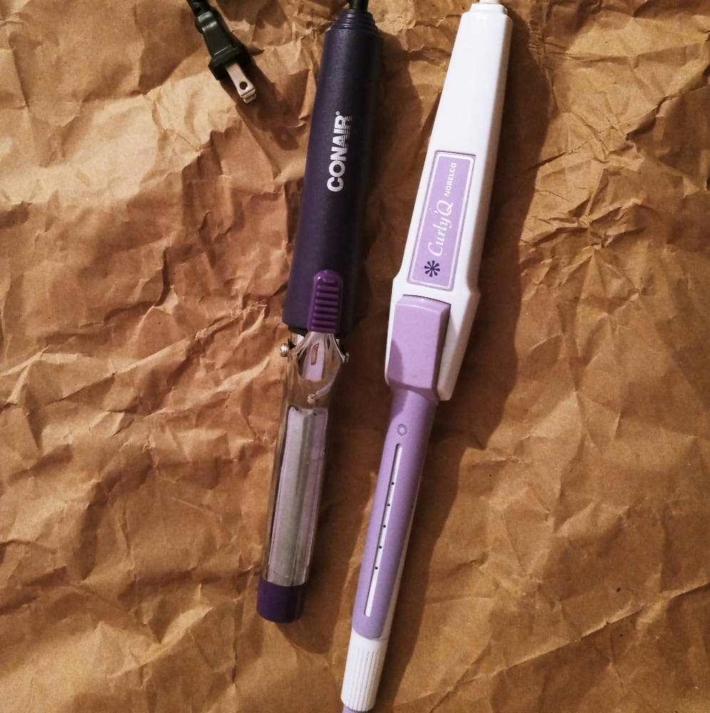 2 working hair curlers, 1 thick and 1 thin.